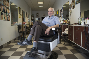 Barber Efstathios Panounis poses for a portrait in his barber shop, after he finished a haircut on Thursday morning December 3, 2015, in Montreal, Que. Steve's Hair Styling, located on Park Avenue, means a lot to the greek community of Montreal, which is based in this area of the city. Like a lot of people from Greece, Panounis moved to Canada during the fifties to find work. Luckely, he could continued the work he was doing in Greece: cutting hair. Panounis started to work as a barber when he was 13 years old. Still today, the majority of his clients are greek. (Marie-Emmanuelle Boileau/Jour 527)